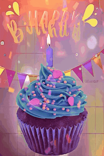 a cupcake with blue frosting and a candle on top of it