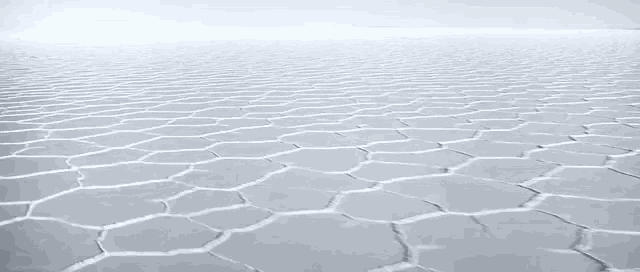 it looks like a soccer field with a lot of cracks in it .