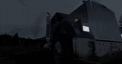 a black semi truck with a license plate that says ' a ' on it