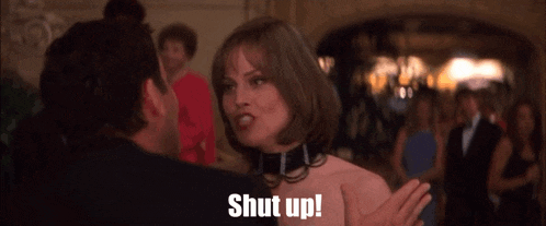 a woman with a collar on her neck is being told to shut up