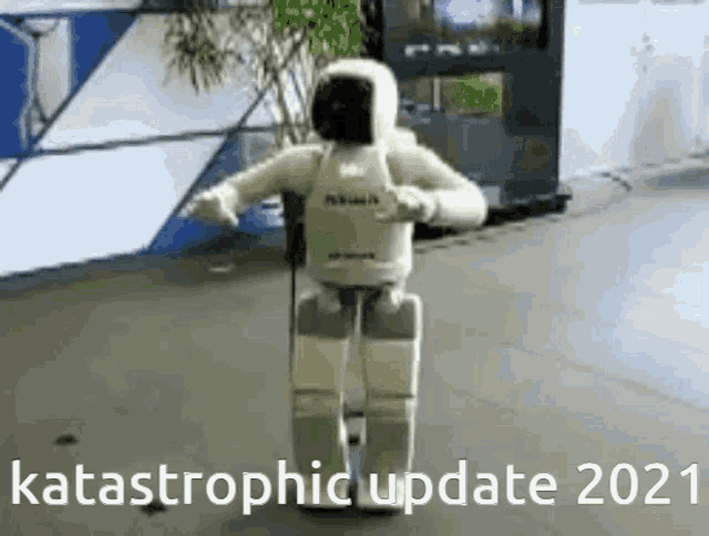 a robot is dancing in a room with the words catastrophic update 2021 .