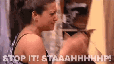 a woman is holding a knife in her hand and says `` stop it ! staaahhhhp ! ''