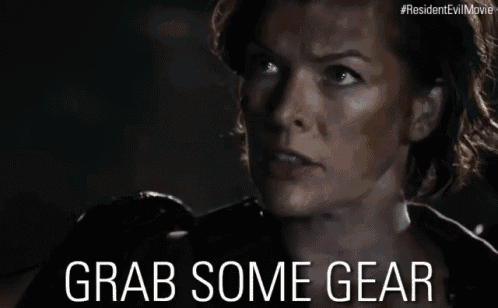 a close up of a woman 's face with the words grab some gear below her