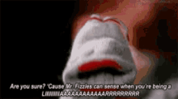 a close up of a sock puppet 's mouth with a caption that says are you sure