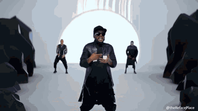a man is dancing in front of a white wall with the hashtag therefaceplace
