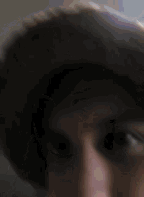 a close up of a person 's face wearing a cowboy hat