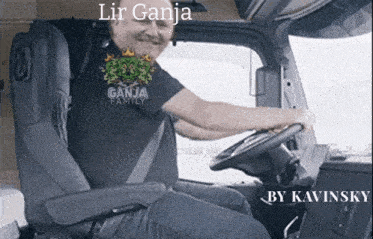a man in a ganja family shirt is sitting in a truck