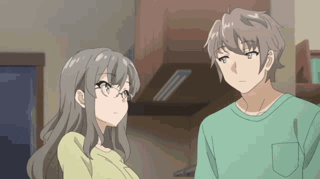 a man and a woman are looking at each other in a kitchen