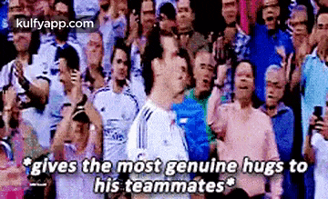 a soccer player is giving the most genuine hugs to his teammates in front of a crowd of people .