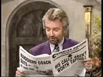 a man in a purple suit is reading a newspaper that says his calls aren t worth taping