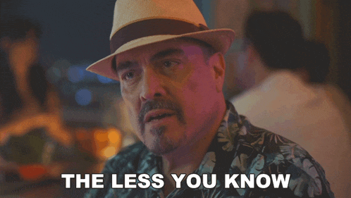 a man wearing a hat and a shirt says the less you know