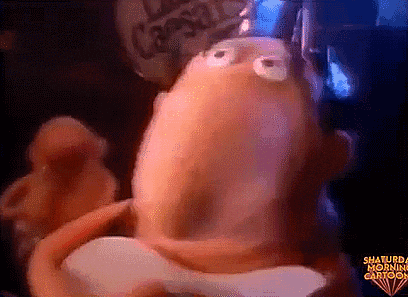 a cartoon character from saturday morning cartoons is holding a spoon in his mouth