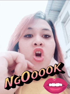 a woman making a funny face with the words ngooook written on her face