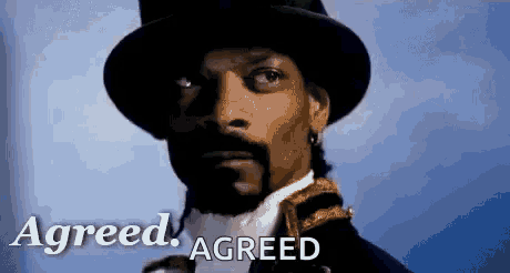 snoop dogg is wearing a top hat and a suit with the words agreed agreed written on the bottom