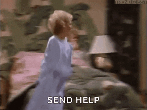 a woman in a blue robe is standing in front of a bed and says send help .