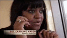 a woman is talking on a cell phone while wearing a ring