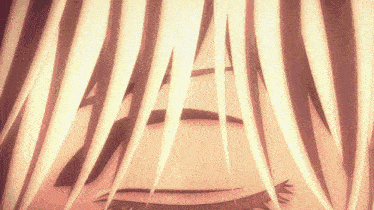 a close up of a person 's eye with long white hair behind it