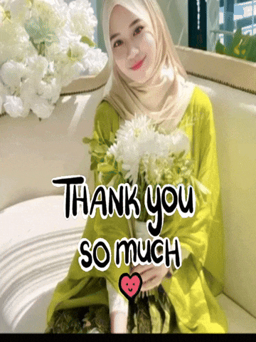 a woman is sitting on a couch with a bouquet of white flowers and the words thank you so much