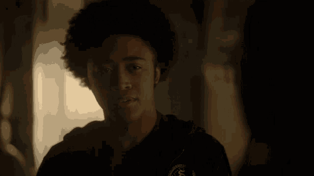 a young man wearing a black hoodie with the word ucsd on it