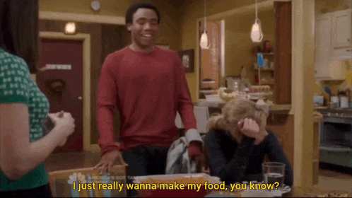a man in a red shirt says i just really wanna make my food you know in a kitchen