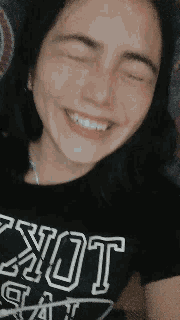 a girl wearing a black shirt that says not a cat