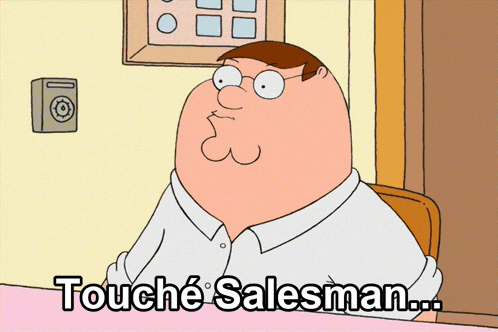 peter griffin from family guy is sitting at a desk and says touche salesman