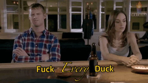 a man and a woman sit at a bar with the words fuck every duck on the top