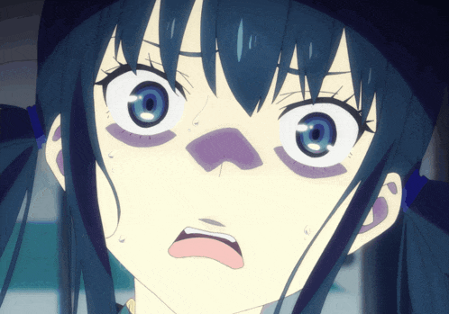 a close up of a girl 's face with a blue eye