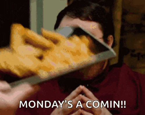 a man eating french fries with the words monday 's a comin written below him