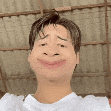 a man in a white shirt makes a funny face