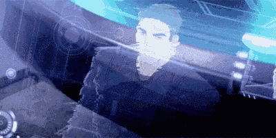 a man is sitting in a chair in front of a screen with a blue light coming out of it .