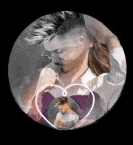 a man in a white shirt is sitting in a circle with a heart around him .