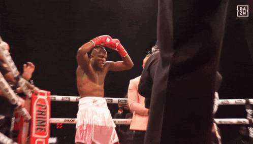 a man in a boxing ring with a dazn logo