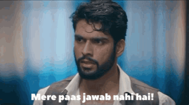 a man with a beard and a vest says mere paas jawab nahi hai
