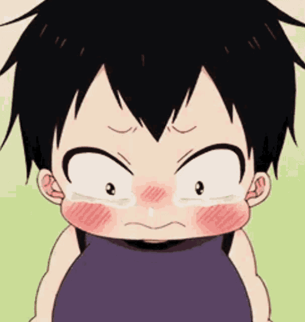 a close up of a baby making a funny face with tears coming out of his eyes .