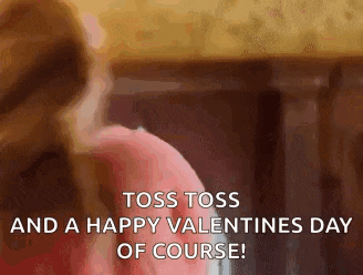 two women are playing a game of toss and a happy valentines day of course !