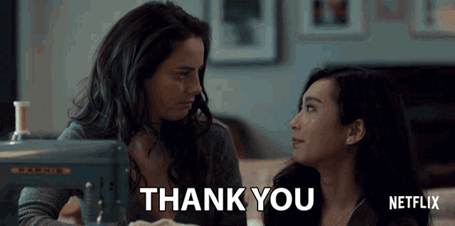 a netflix ad shows two women looking at each other