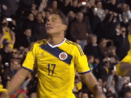 a man in a yellow shirt with the number 17 on it
