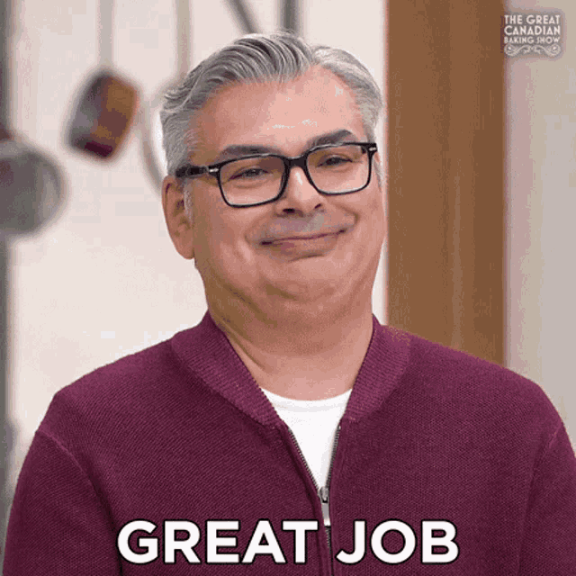 a man wearing glasses and a purple sweater says great job