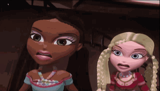 two dolls are standing next to each other with their faces making funny faces