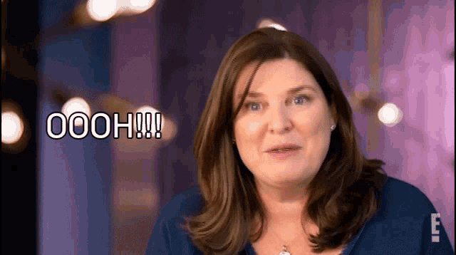 a woman with a surprised look on her face says oooh
