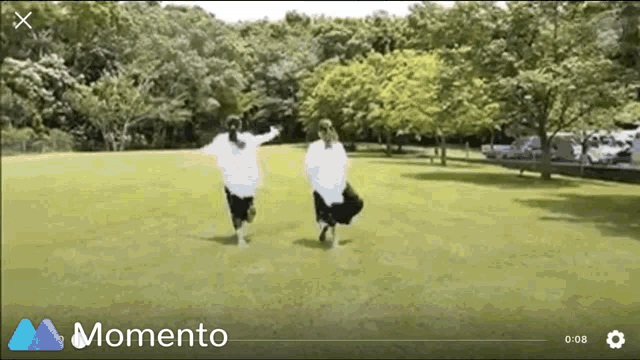 a momento video shows two girls running in a field