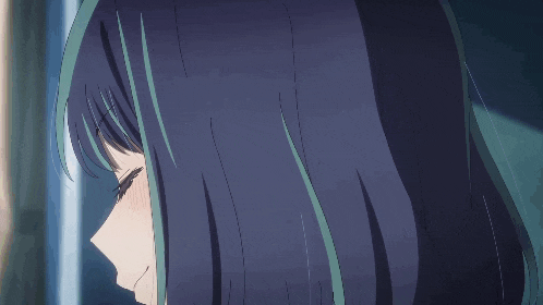 a close up of a girl with blue hair