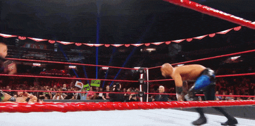 a wrestler in a ring with a sign that says ' smackdown ' on it