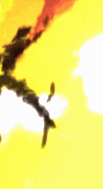 a blurry picture of a yellow background with a white cloud in the middle