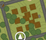 an aerial view of a wooded area with trees and a white arrow pointing to the left