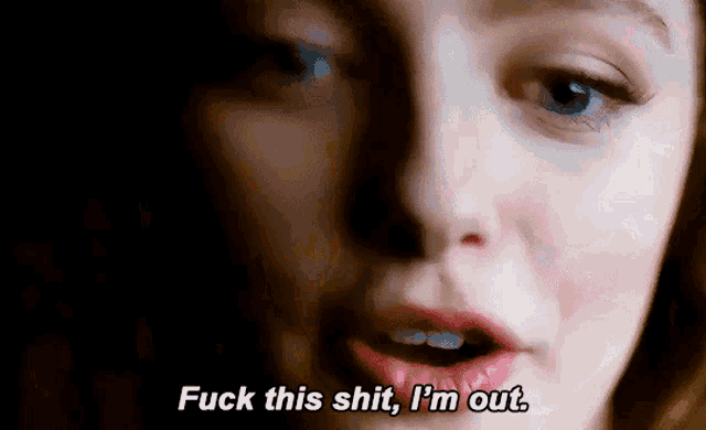 a close up of a woman 's face with the words `` fuck this shit , i 'm out . ''