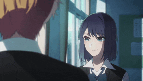 a boy and a girl are standing next to each other