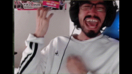 a man with a beard wearing headphones and a white shirt is making a funny face .