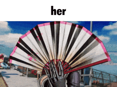 a person is holding a fan in front of their face and the word her is above them